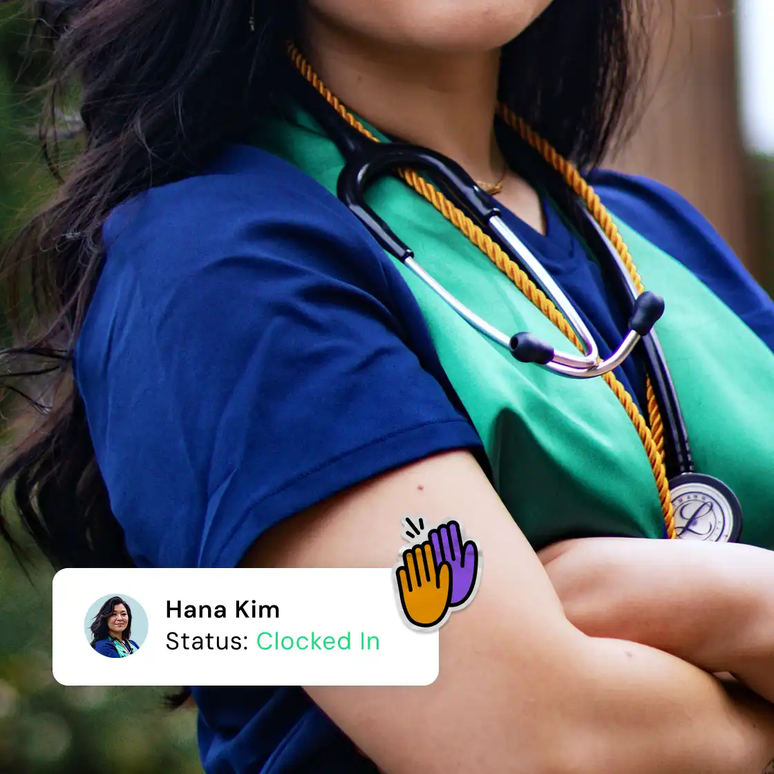 A person wearing a blue scrub top and green sash with a stethoscope draped around their neck. A badge below shows "Hana Kim, Status: Clocked In."