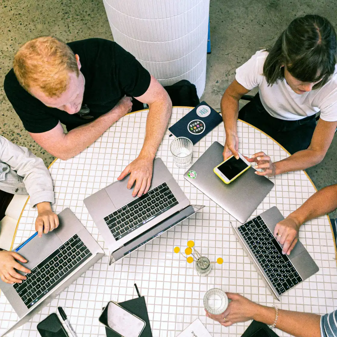 people in a tech startup working